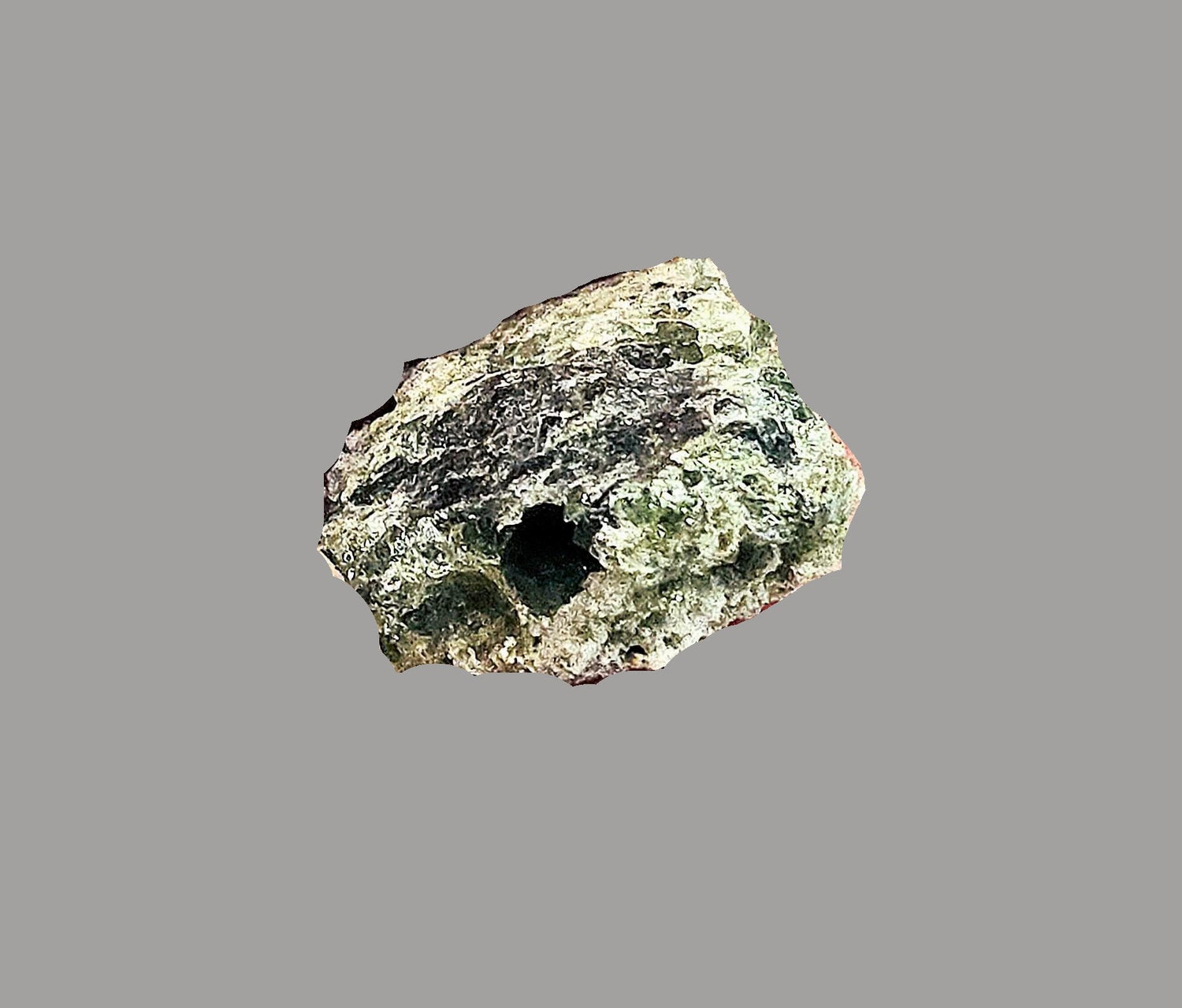 Green with black inclusions